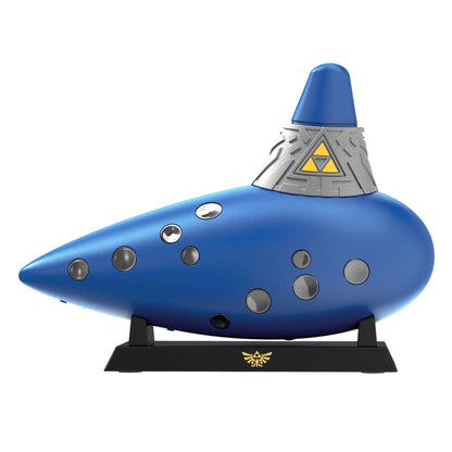 Blue Hori Ocarina controller displayed on black stand with gold Hylian Crest base