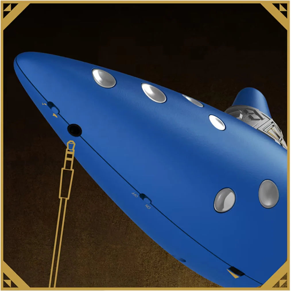 Close-up of Hori electric ocarina side showing audio jack, power switch and silver buttons