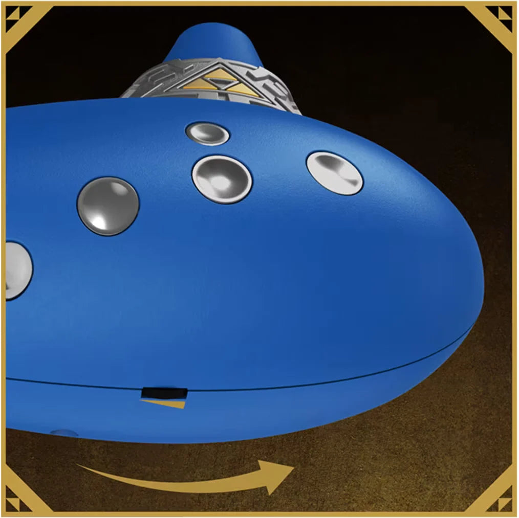 Detail shot of Hori electric ocarina body with silver buttons and Triforce symbol