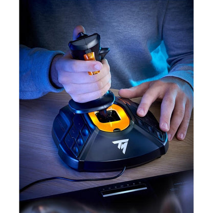 User operating Thrustmaster T.16000M FCS joystick with right hand on wooden desk