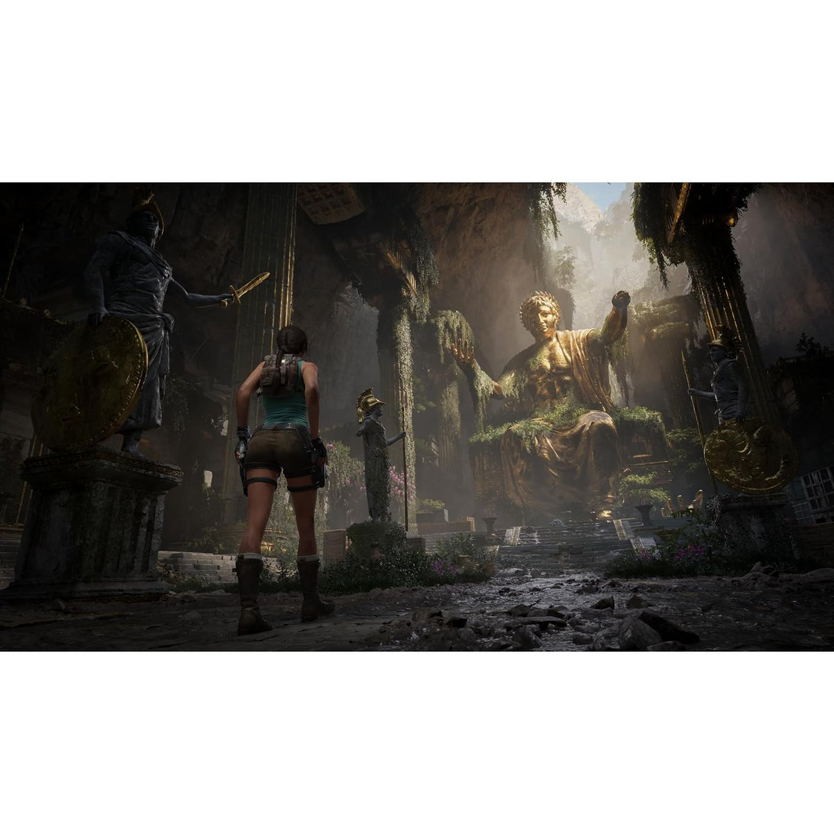 Lara Croft facing massive golden seated statue in overgrown cavern temple